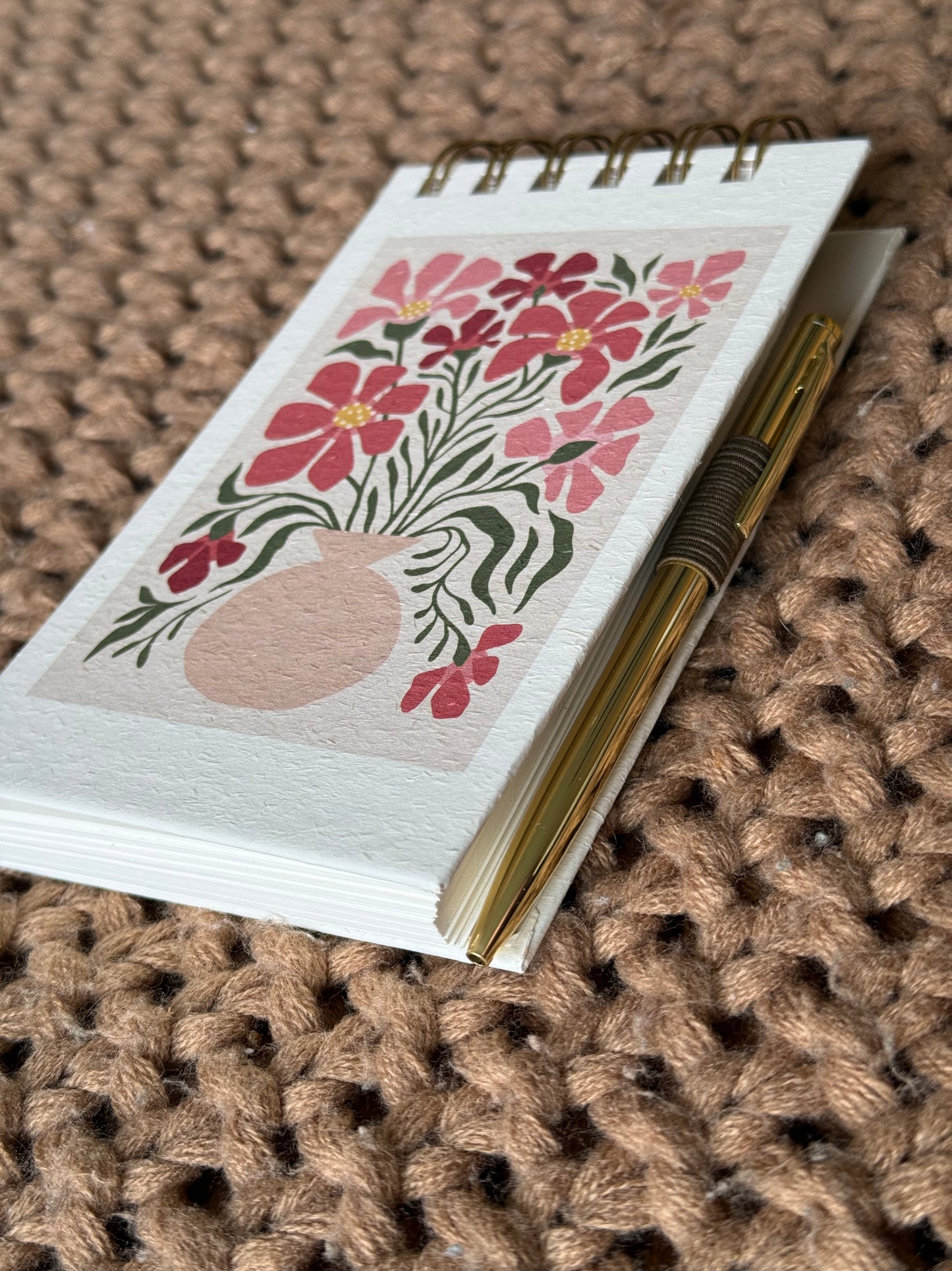 Spiral notepad with pen
