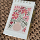 Spiral notepad with pen
